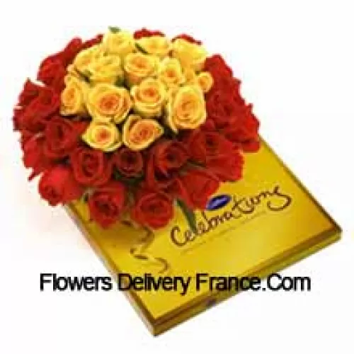 Bouquet de 24 roses rouges et 11 jaunes avec des garnitures de saison accompagné d'une belle boîte de chocolats Cadbury