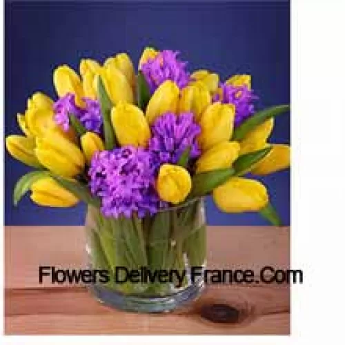 Yellow Tulips Arranged Beautifully In A Glass Vase - Please Note That In Case Of Non-Availability Of Certain Seasonal Flowers The Same Will Be Substituted With Other Flowers Of Same Value