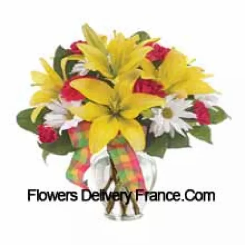 Yellow Lilies, Red Carnations And Suitable Seasonal White Flowers Arranged Beautifully In A Glass Vase