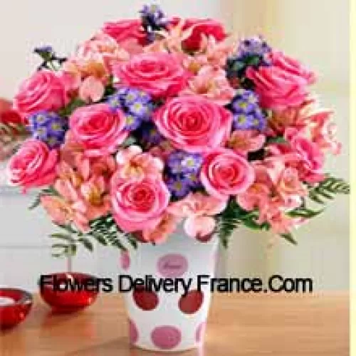 Pink Roses, Pink Orchids And Assorted Purple Flowers Arranged Beautifully In A Glass Vase