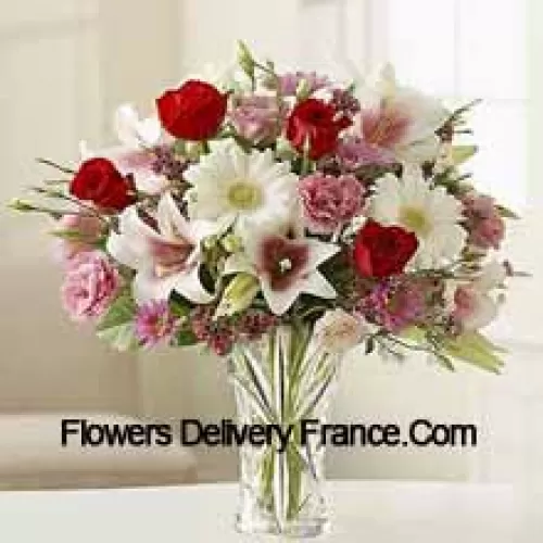 Red Roses, Pink Carnations White Gerberas And White Lilies With Other Assorted Flowers In A Glass Vase