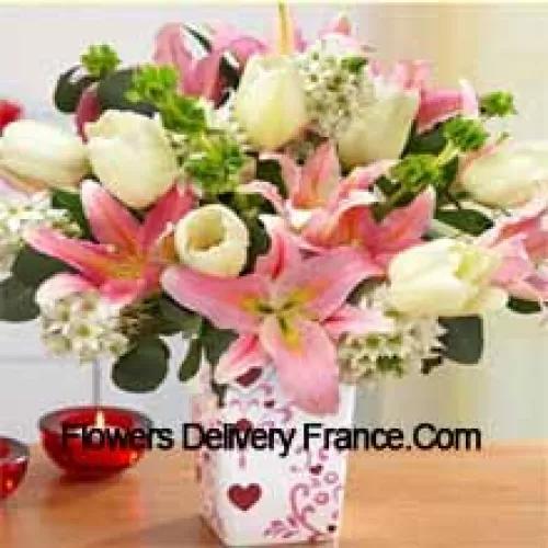 Pink Lilies And White Tulips With Assorted White Fillers In A Glass Vase - Please Note That In Case Of Non-Availability Of Certain Seasonal Flowers The Same Will Be Substituted With Other Flowers Of Same Value