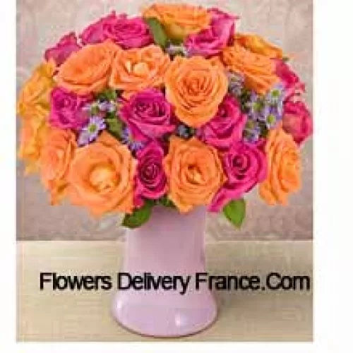 15 Pink And 10 Orange Roses With Seasonal Fillers In A Glass Vase