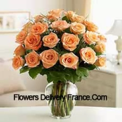 25 Peach Roses With Some Ferns In A Glass Vase