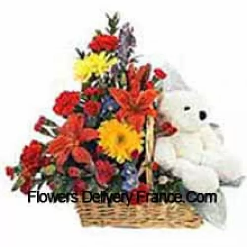 Panier de fleurs assorties avec un mignon ours en peluche